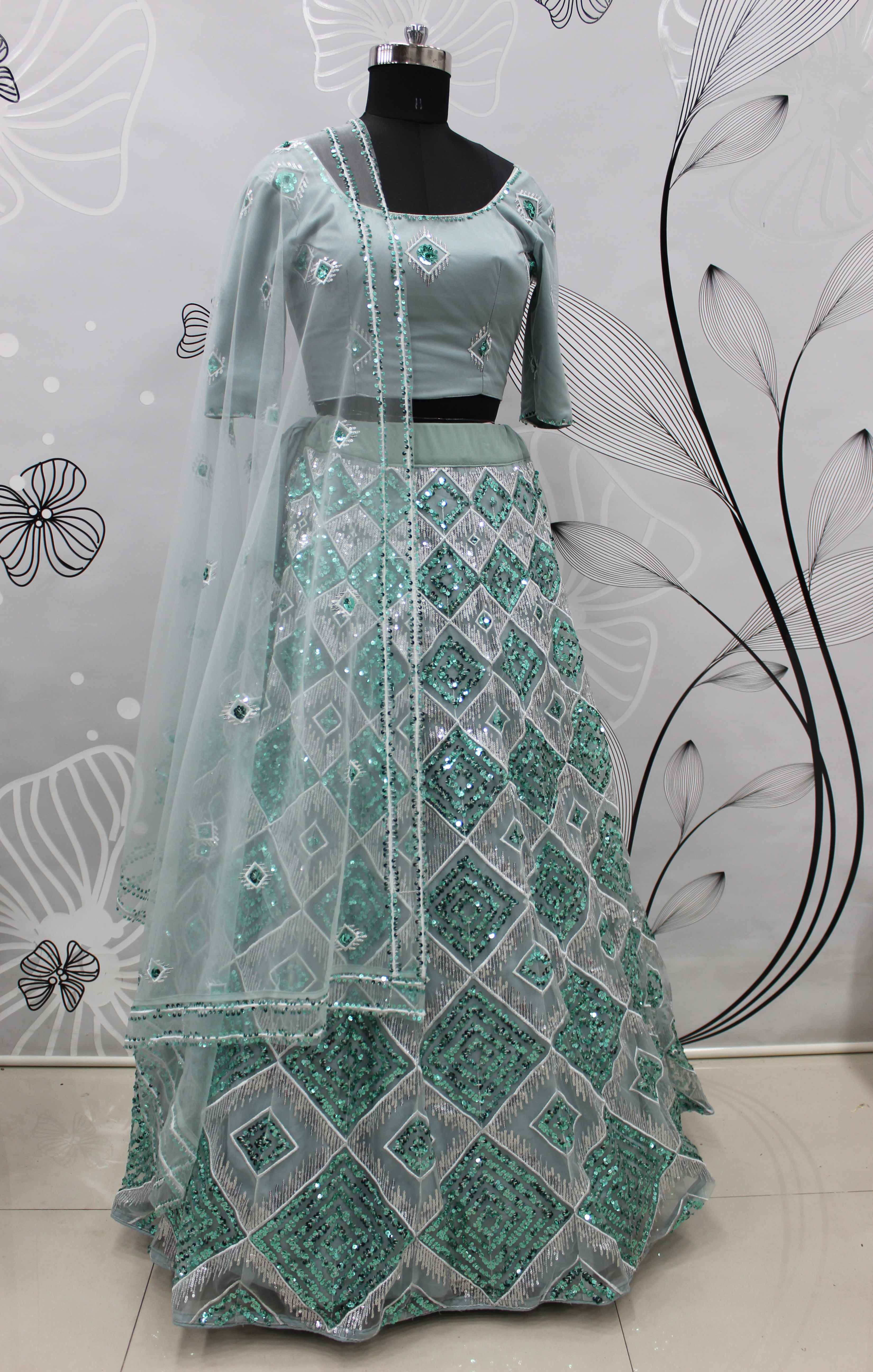 Net Lehenga Choli in greyish Blue with Embroidered